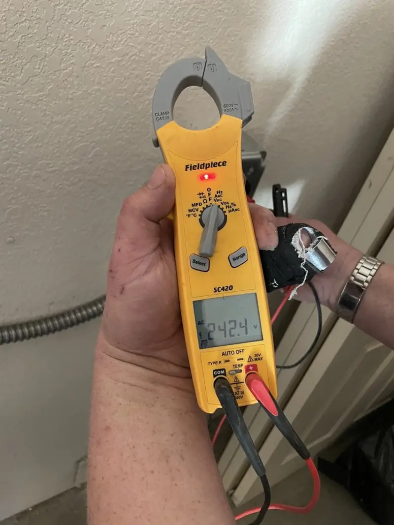 Voltage testing with clamp meter during Outlet Installation in Bellmead